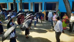 নীলফামারীতে প্রাথমিক শিক্ষার্থীদের মাঝে ছাতা ও ব্যাগ বিতরণ